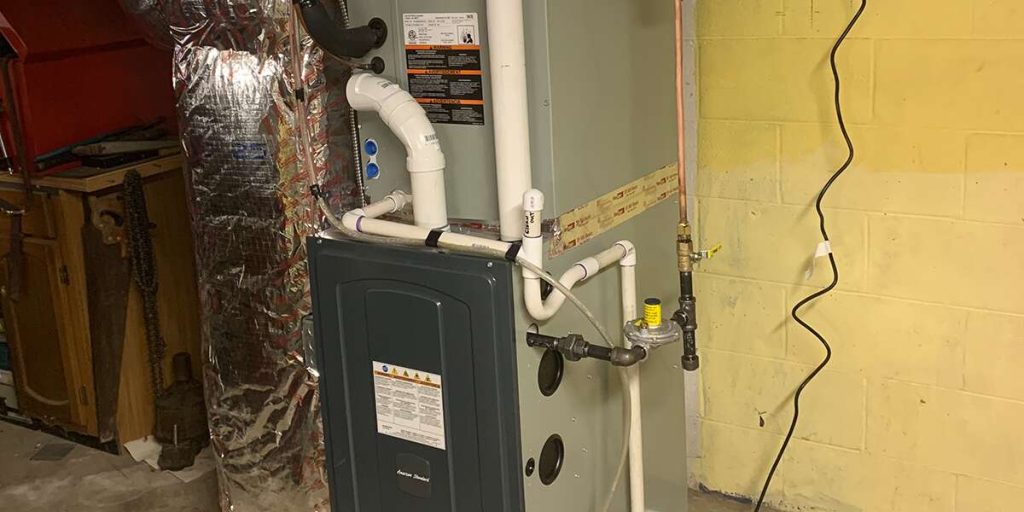 Residential furnace with PVC piping and gas line connection